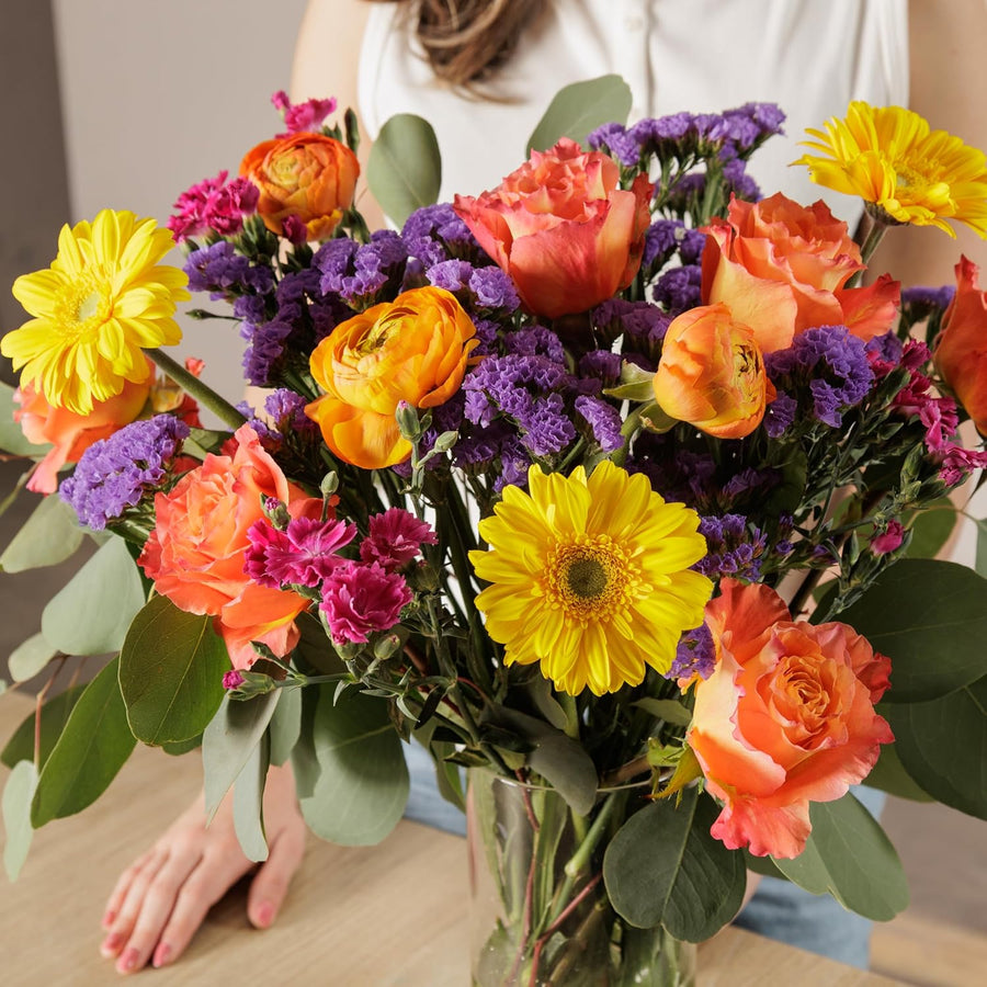 Bright birthday gift bouquet with gerberas and roses