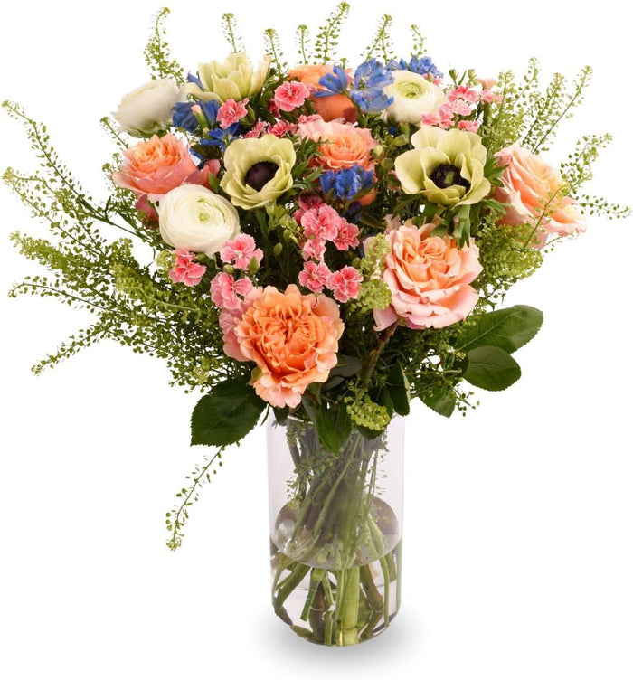 The Garden Bouquet with peach roses and white blooms in a glass vase