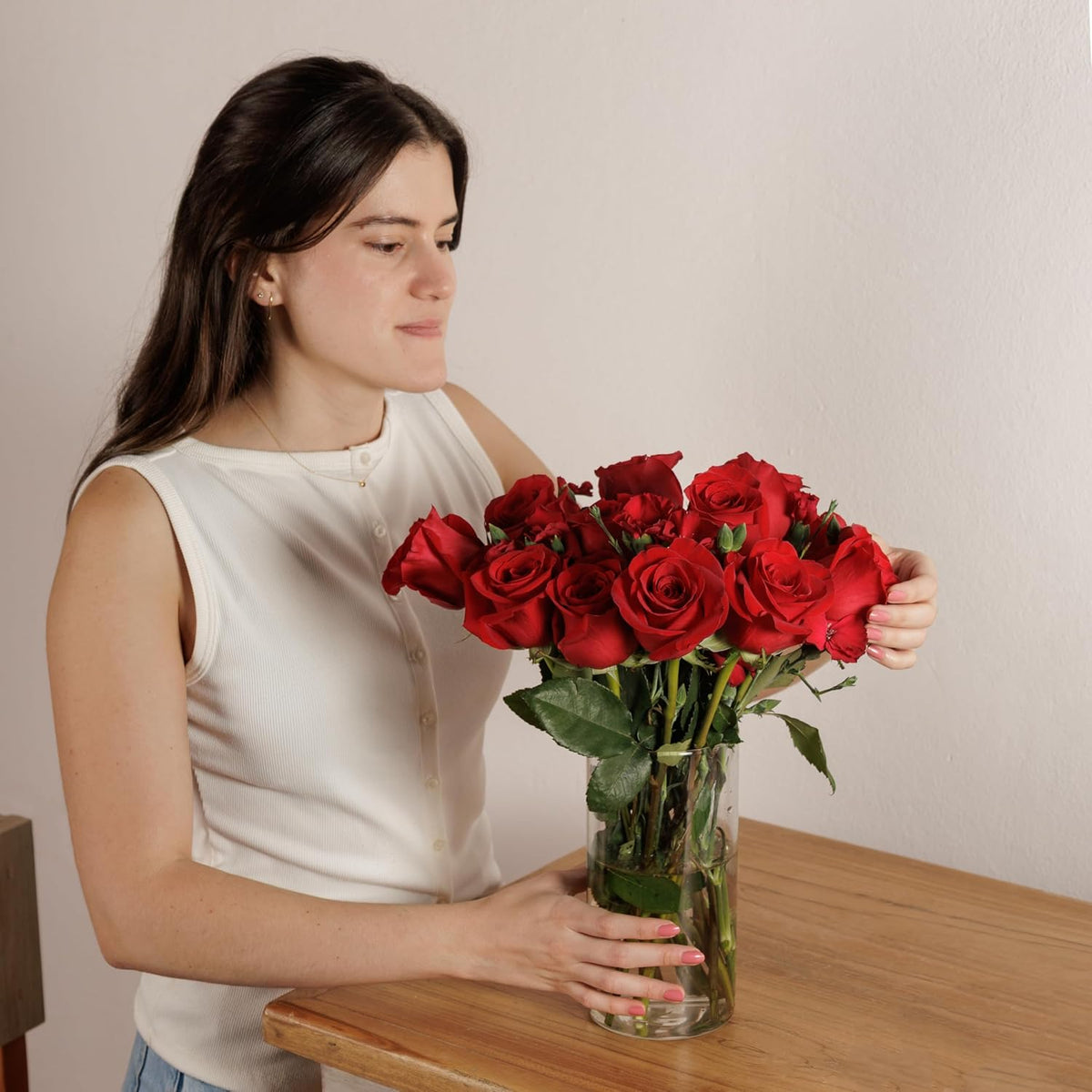 Woman holding a bouquet of red roses
