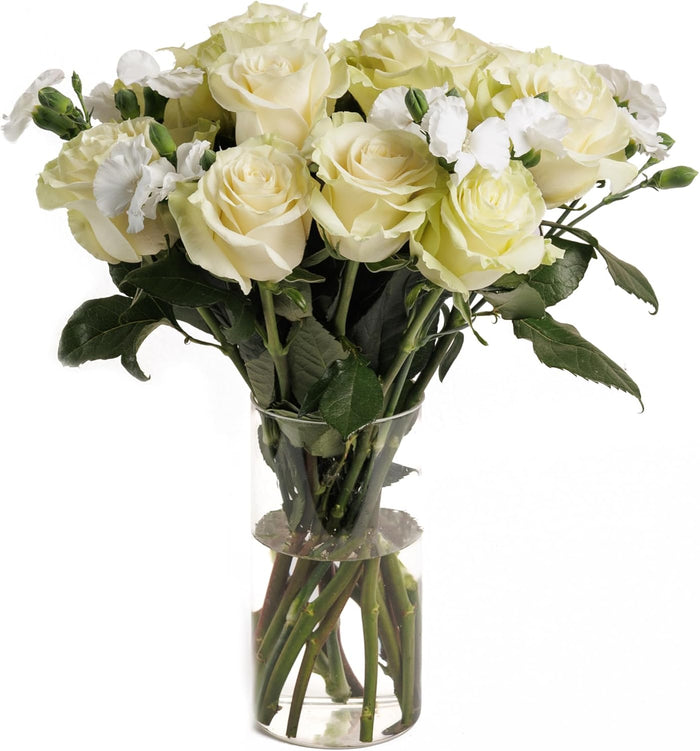 Pure Grace bouquet of white roses in a glass vase